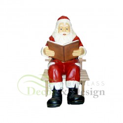 Decorative figure Santa sitting on the bench
